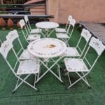 9003532_2.jpg Set da esterno in ferro con tavolo tondo pieghevole e quattro sedie richiudibili da restaurare