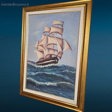 Dipinto incorniciato con galeone su mare mosso in cornice dorata
