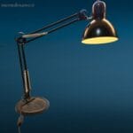 lampada a molle snodata con base in ghisa colore nero, stile vintage industriale