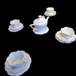 Servizio da tè in ceramica per 4 persone con teiera, tazze sagomate e piattini eleganti